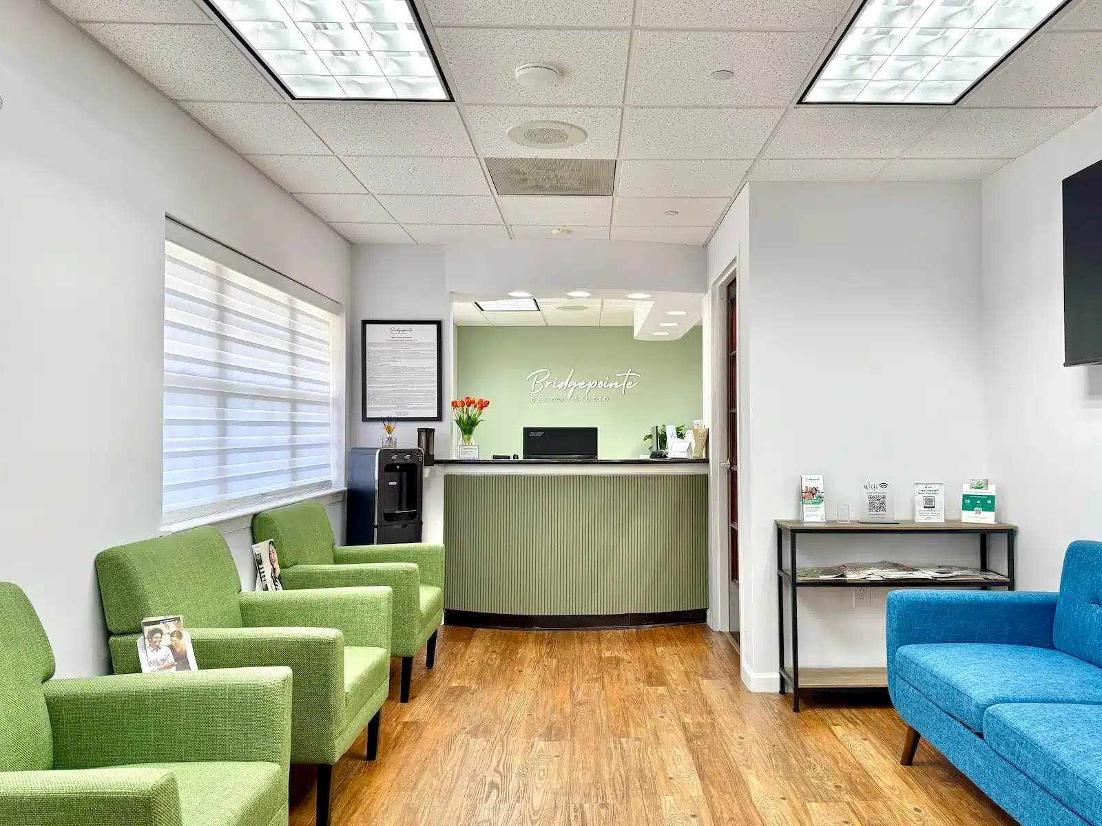 Modern dental office waiting room at Bridgepointe Dental Studio in Metuchen NJ with comfortable seating and clean design